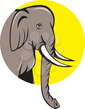 Illustration of an Indian elephant head with tusks viewed from side on isolated background set inside circle done in cartoon style.