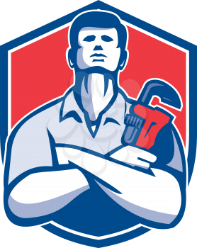 Illustration of a handyman plumber repairman worker arms folded holding monkey wrench viewed from front set inside shield crest on isolated background done in retro style.