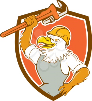 Illustration of a bald eagle plumber smiling with hardhat holding monkey wrench viewed from side set inside shield crest done in cartoon style. 