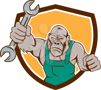 Illustration of an angry gorilla ape mechanic with spanner punching facing front set inside shield crest on isolated background done in cartoon style. 