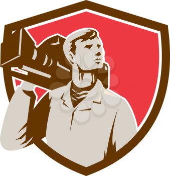 Illustration of a cameraman holding a vintage movie video camera on shoulder looking to the side set inside shield crest on isolated background done in retro style.