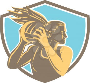 Illustration of a netball player catching rebounding ball looking to the side set inside shield crest on isolated background.