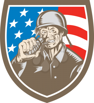 Illustration of a World War two American soldier serviceman biting grenade viewed from front set inside shield crest with usa american stars and stripes flag in the background done in retro woodcut st