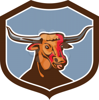 Illustration of a texas longhorn red bull head tongue out set on inside shield crest on isolated background done in retro style. 