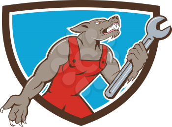 Illustration of a wolf mechanic holding spanner looking up viewed from side set inside shield crest on isolated background done in cartoon style. 