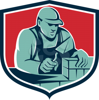 Illustration of a mason masonry construction worker holding trowel working on bricks viewed from front set inside shield crest done in retro style. 