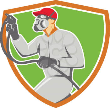 Illustration of car painter wearing face mask holding paint spray gun spraying viewed from the side set inside shield crest done in retro style.