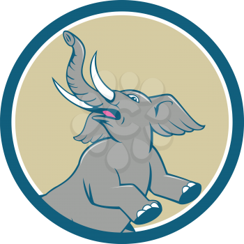 Illustration of an african elephant prancing looking up to the side set inside circle on isolated background done in cartoon style. 