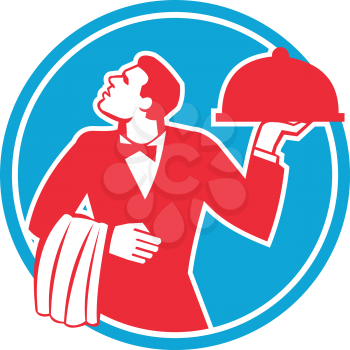Illustration of a butler waiter serving food in a platter looking to the side viewed from front set inside circle on isolated background done in retro style. 