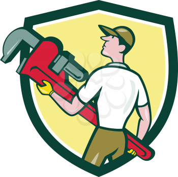 Illustration of a plumber wearing hat walking lifting giant monkey wrench looking to the side viewed from rear set inside shield crest on isolated background done in cartoon style. 