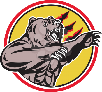 Illustration of a angry California grizzly North American brown bear swiping his paw attacking done in retro style set inside circle.