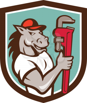 Illustration of a horse plumber holding monkey wrench set inside shield crest on isolated background done in cartoon style. 
