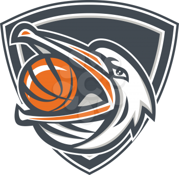 Illustration of a head of a pelican bird with basketball in mouth looking up to the side set inside shield crest done in retro style. 