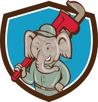 Illustration of an african elephant plumber mascot holding monkey wrench on shoulder set inside shield crest on isolated background done in cartoon style. 