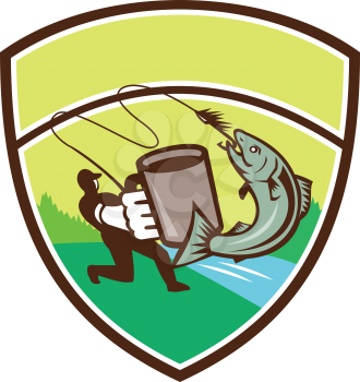 Illustration of a fly fisherman fishing holding mug hooking salmon jumping viewed from the side set inside shield crest with river sea and trees in the background done in retro style