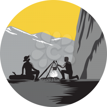 Two people sitting around a campfire. One kneeling and cooking, while one sitting on a log and looking up at 1000 foot sheer wall about 50 yards away set inside circle with mountains in the background