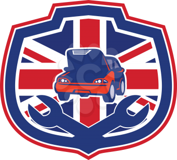 Icon retro style illustration of a British auto automobile car repair shop with crossed spanner wrench and United Kingdom UK, Great Britain Union Jack flag set inside crest on isolated background.