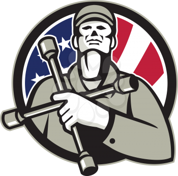 Illustration of an American tire mechanic wearing hat holding tire wrench 4-way lug wrench or tyre iron on chest looking up inside circle with USA flag stars and stripes in background in retro style. 