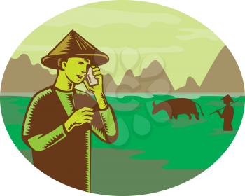 Retro woodcut style illustration of Vietnamese farmer wearing conical hat talking on mobile, cellular phone or cellphone with mountain and rice paddy field in background set inside oval, 