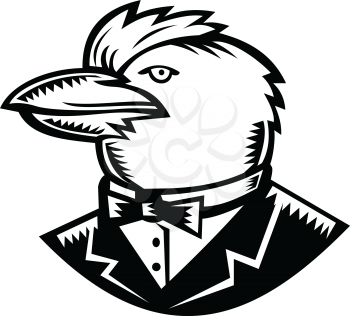 Retro woodcut style illustration of head of Kookaburra, a terrestrial tree kingfisher of genus Dacelo, native to Australia and New Guinea, wearing tuxedo coat and bow tie side on isolated background.