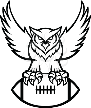 Mascot illustration of a great horned owl, tiger owl or hoot owl, a large owl native to the Americas, clutching an American football ball viewed from front in retro black and white style.