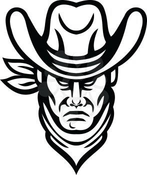Mascot icon illustration of head of an American cowboy wearing kerchief and hat viewed from front on isolated background in retro black and white style.