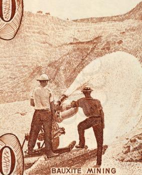Royalty Free Photo of Bauxite Mining on 10 Dollars 1992 Banknote from Guyana.