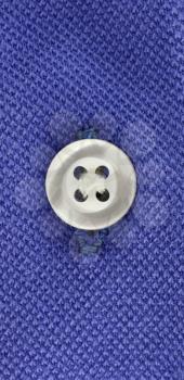 Royalty Free Photo of a Button on Cloth