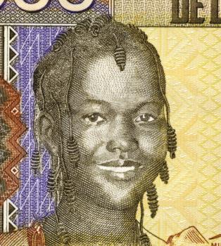 Royalty Free Photo of Girl on 1000 Francs 2006 Banknote from Guinea.
