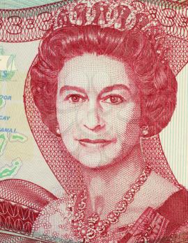 Royalty Free Photo of Queen Elizabeth II (1926-) on 3 Dollars 1984 Banknote from Bahamas. Queen regnant of 16 independent sovereign states known as the Commonwealth realms.