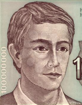 Royalty Free Photo of Young Man on 100000000 Dinara 1993 Banknote from Yugoslavia