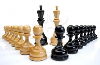 Several wooden chess pieces light and dark colors