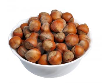 Hazelnuts in a white cup on a white background, isolated