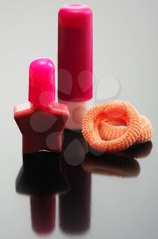 Royalty Free Photo of Lipstick, Nail Polish and Hair Accessories for a Child