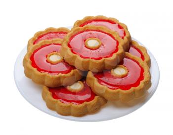 Brown Cookies with red jelly on a white plate, isolated