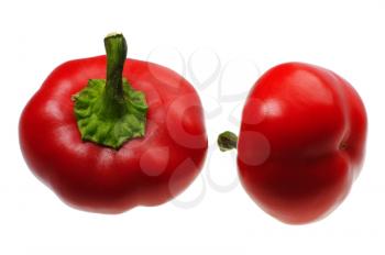 Two small round red peppers on a white background, isolated.
