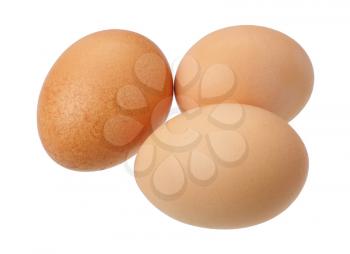 Three brown eggs on a white background, isolated.