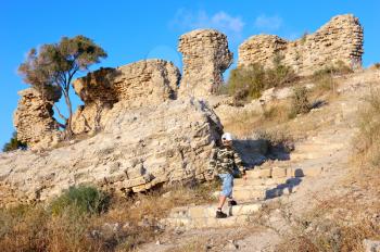 Royalty Free Photo of a Person on Remnants of Fortifications That Were Built by the Crusaders in Ashqelon, Israel