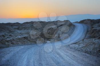 Royalty Free Photo of a Desert Road at Sunrise
