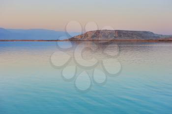 Royalty Free Photo of the Dead Sea Shortly Before Dawn and the Jordanian Mountains in the Background.