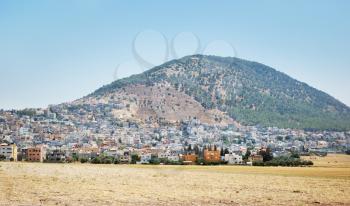 Royalty Free Photo of Mount Tabor and an Arab City