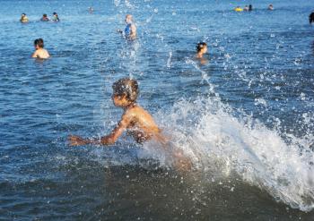 Royalty Free Photo of a Child Splashing in the Water