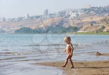 Royalty Free Photo of a Child at the Beach of Lake Kinneret