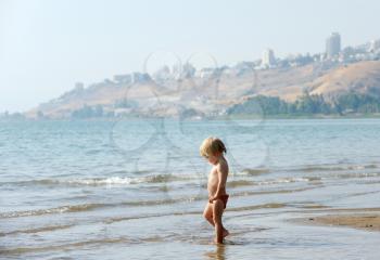 Royalty Free Photo of a Child in the Water at Lake Kinneret