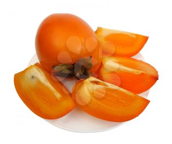 Royalty Free Photo of a Persimmon and Slices on a Plate