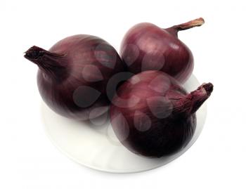 Purple onions on a white plate on a white background, isolated