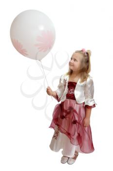 Royalty Free Photo of a Girl in a Fancy Dress Holding a Balloon