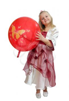 Girl in a smart dress plays with a red balloon.