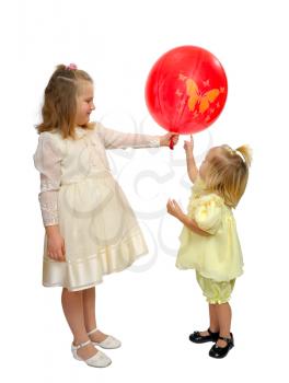 Royalty Free Photo of Two Girls in Fancy Dresses With a Balloon