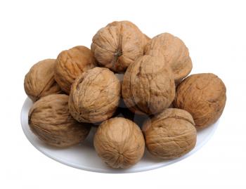 Walnuts  in a white plate on a white background, isolated